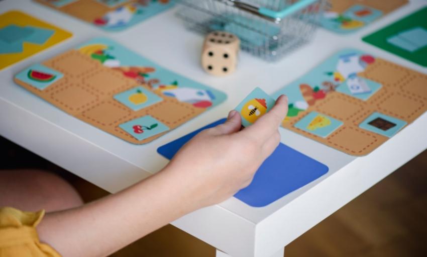 Child playing a preschool board game image